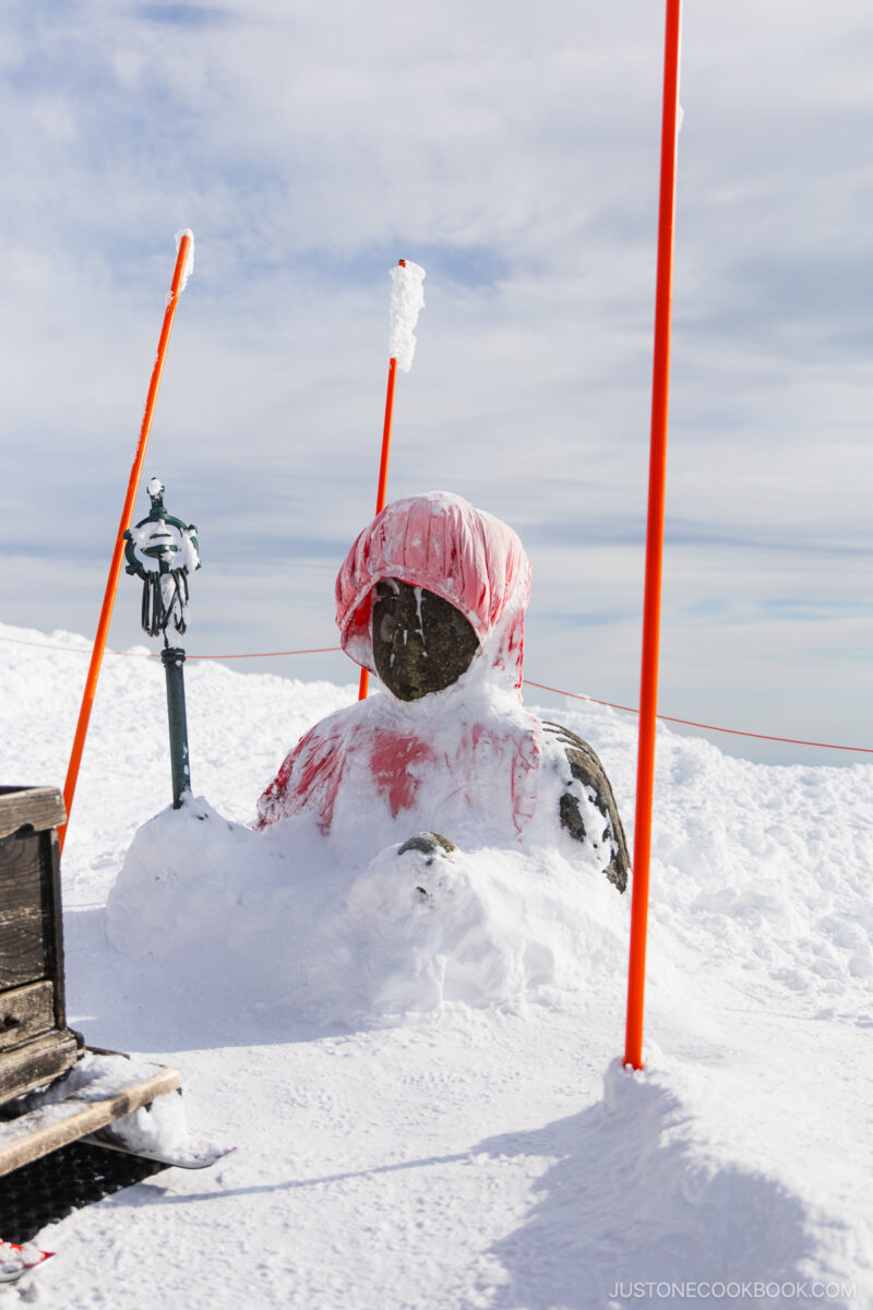 Jizo statue covered in snow