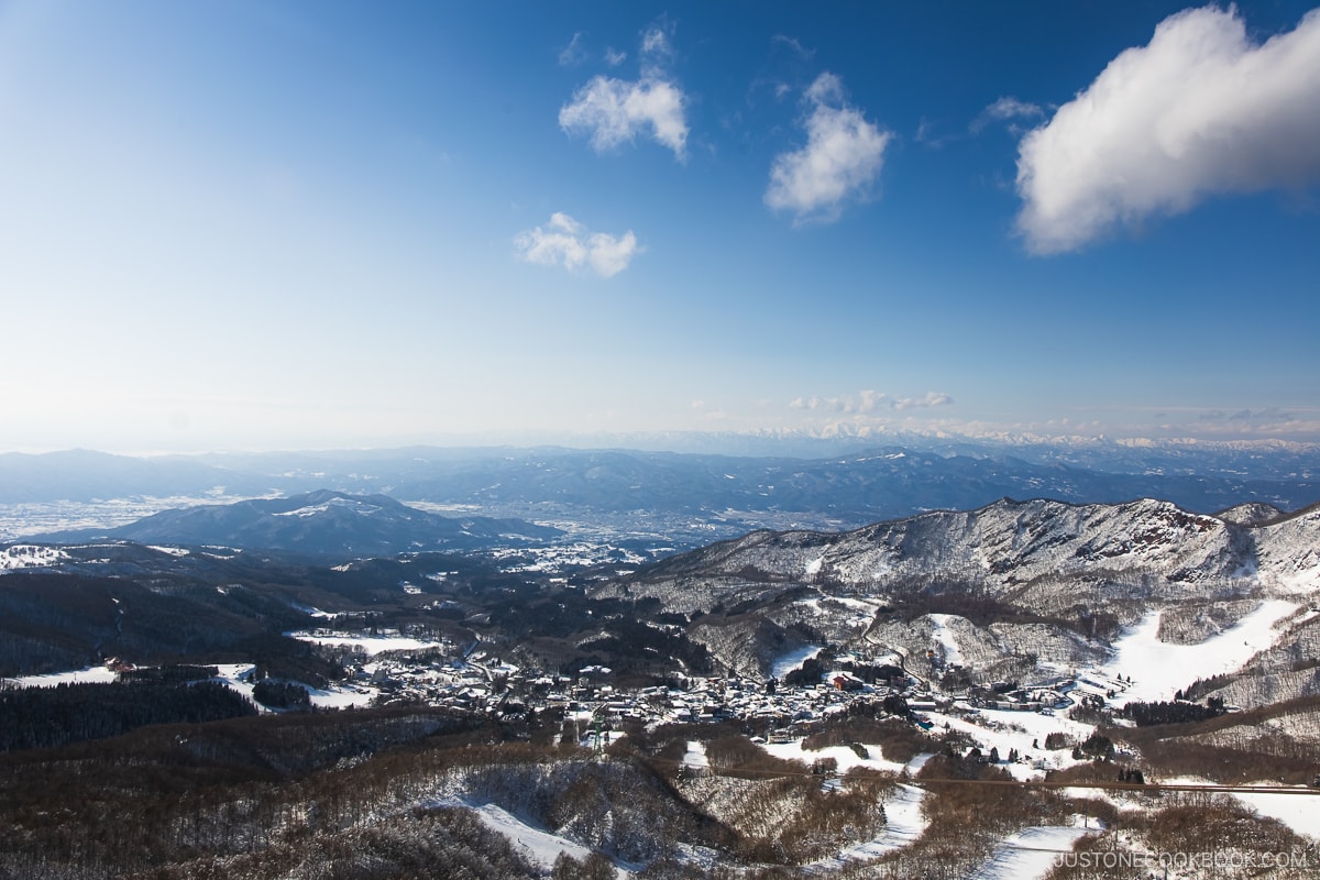 View overlooking Zao Ski Resort with snowy mountains in the background