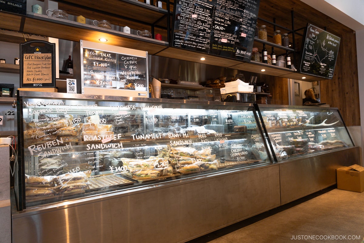 Glass display selling sandwiches at Green Farm Deli Cafe in Niseko