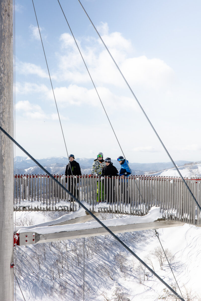 People on a sky bridge overlooking Tomamu Ski Resort