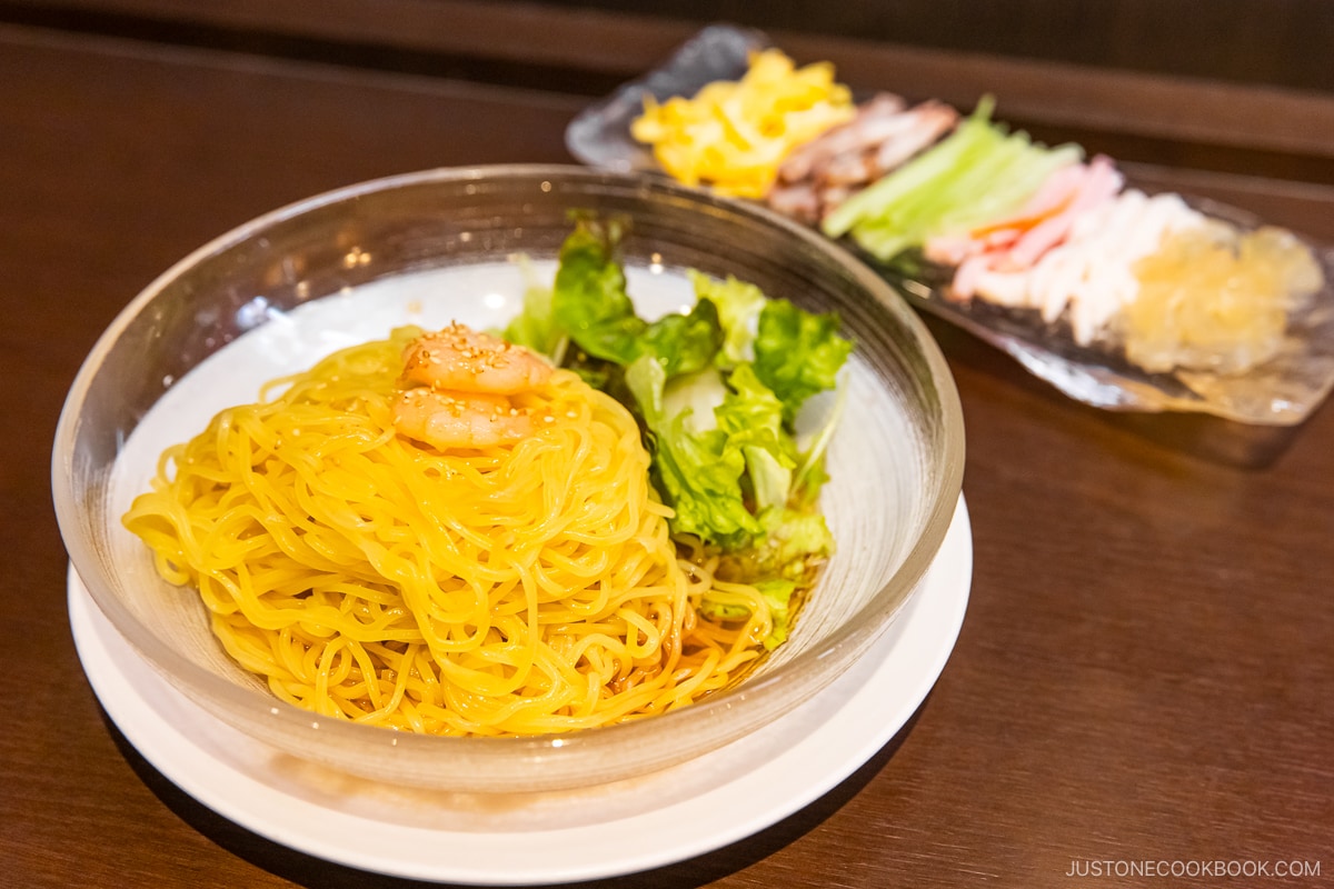 Glass bowl of Hiyashi Chuka topped with prawns
