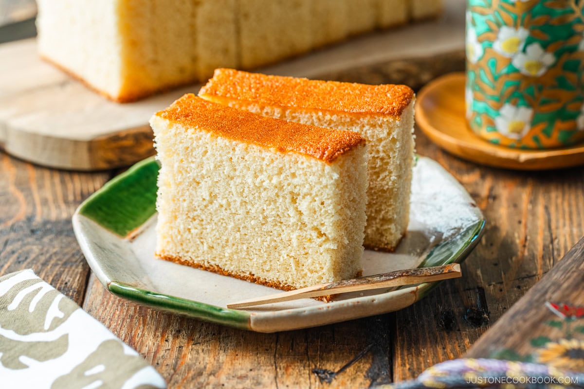 An octagon plate containing two slices of Castella cake.