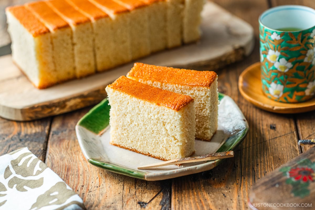 An octagon plate containing two slices of Castella cake.