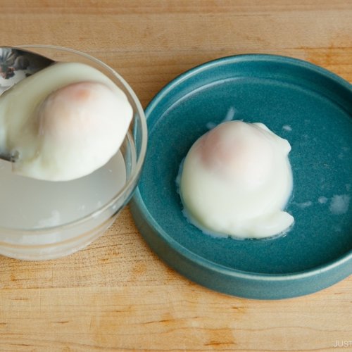 A plate containing Onsen Tamago (Japanese hot spring egg) made with a microwave.