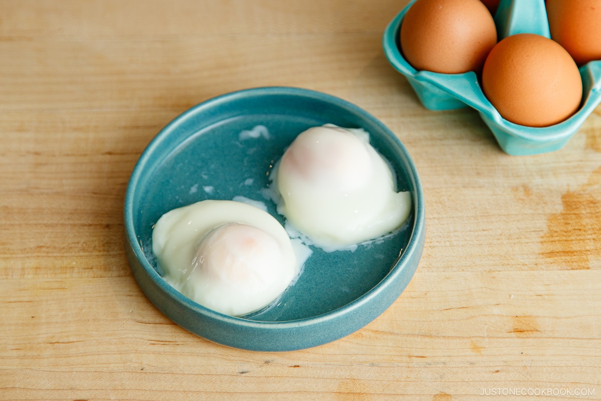 A plate containing Onsen Tamago (Japanese hot spring egg) made with a microwave.