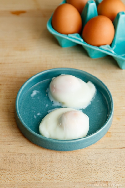 A plate containing Onsen Tamago (Japanese hot spring egg) made with a microwave.