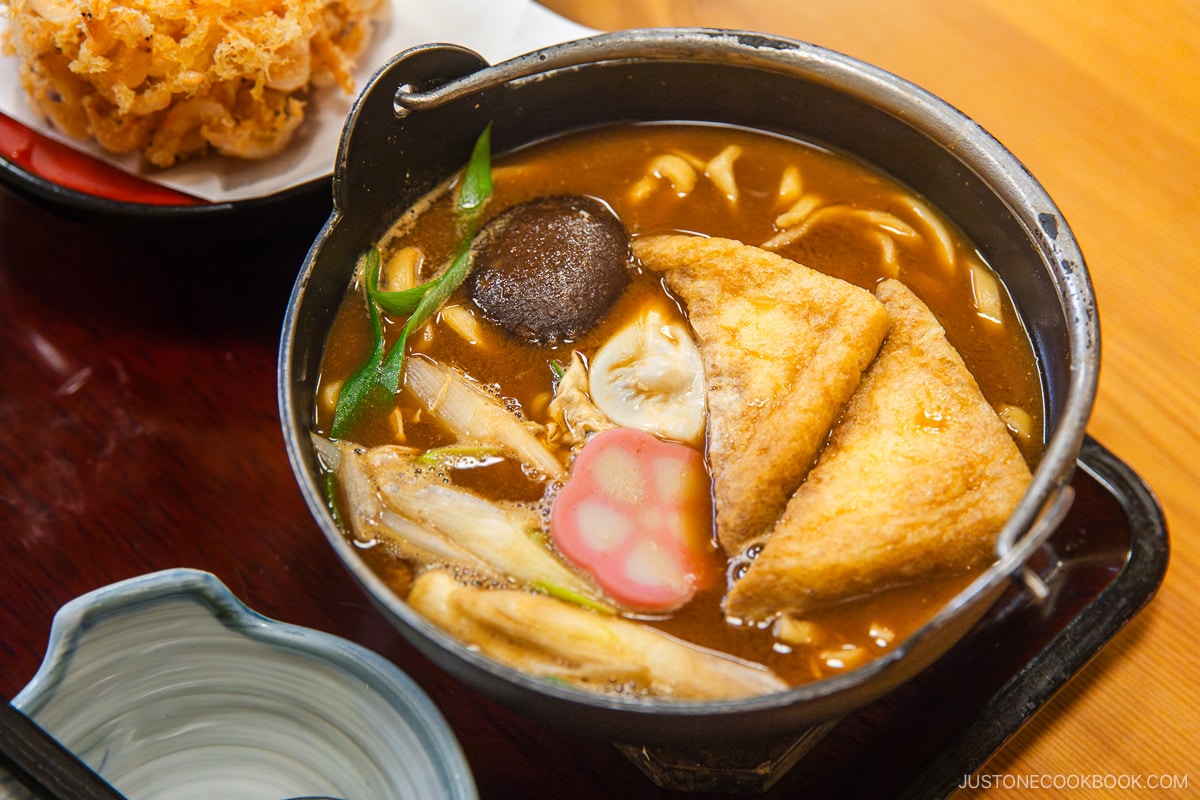 Udon noodles with miso broth, deep fried tofu, shiitake mushroom, and green onions