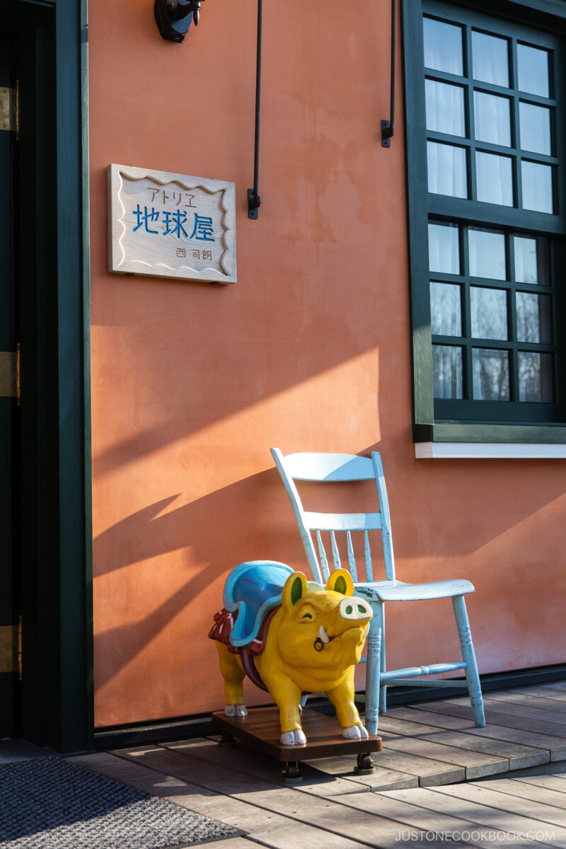 Pig and chair outside of the World Emporium