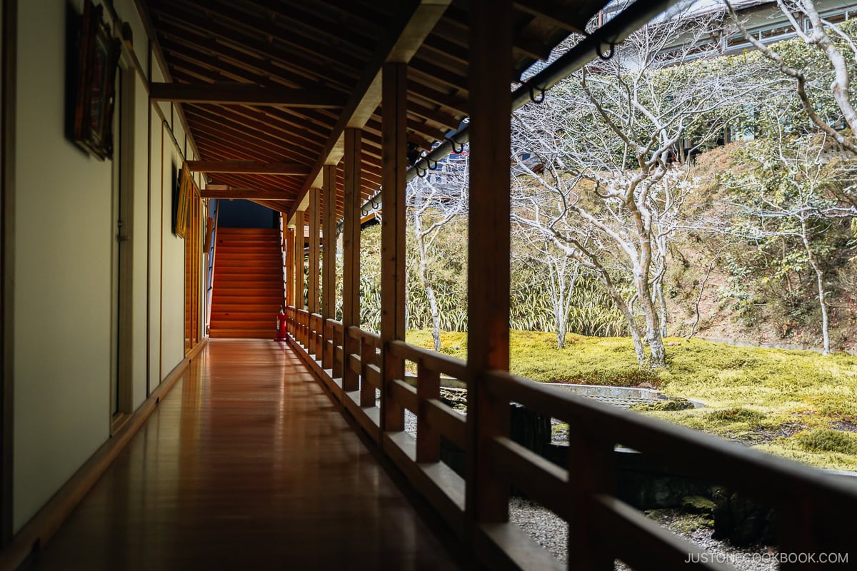 Temple wooden hallway next to outside garden