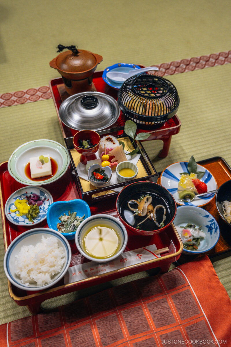 Dinner with various small dishes, rice, and soup