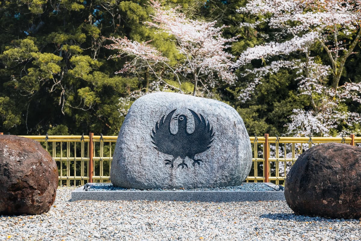 Stone monument with engraved bird