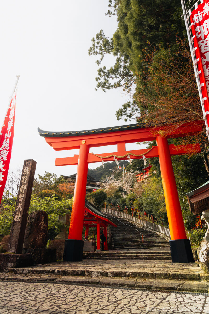 Red torii gate with stairs leading to shrine