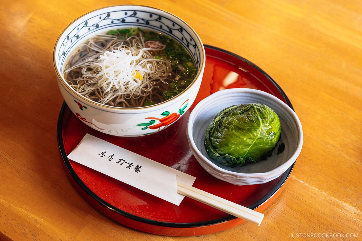 Soba with rice wrapped in mustard greens pickled in salt.