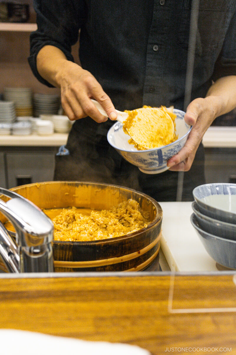Chef preparing bowl of rice
