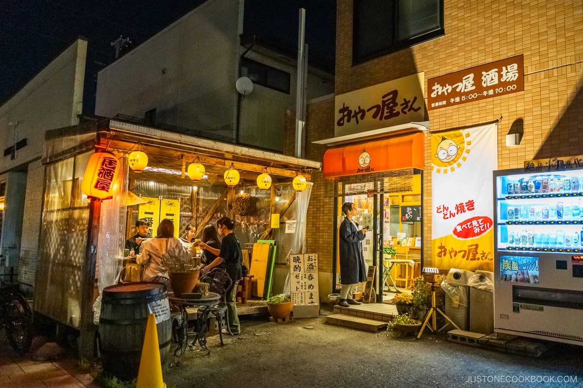 Restaurant exterior at night with outside seating