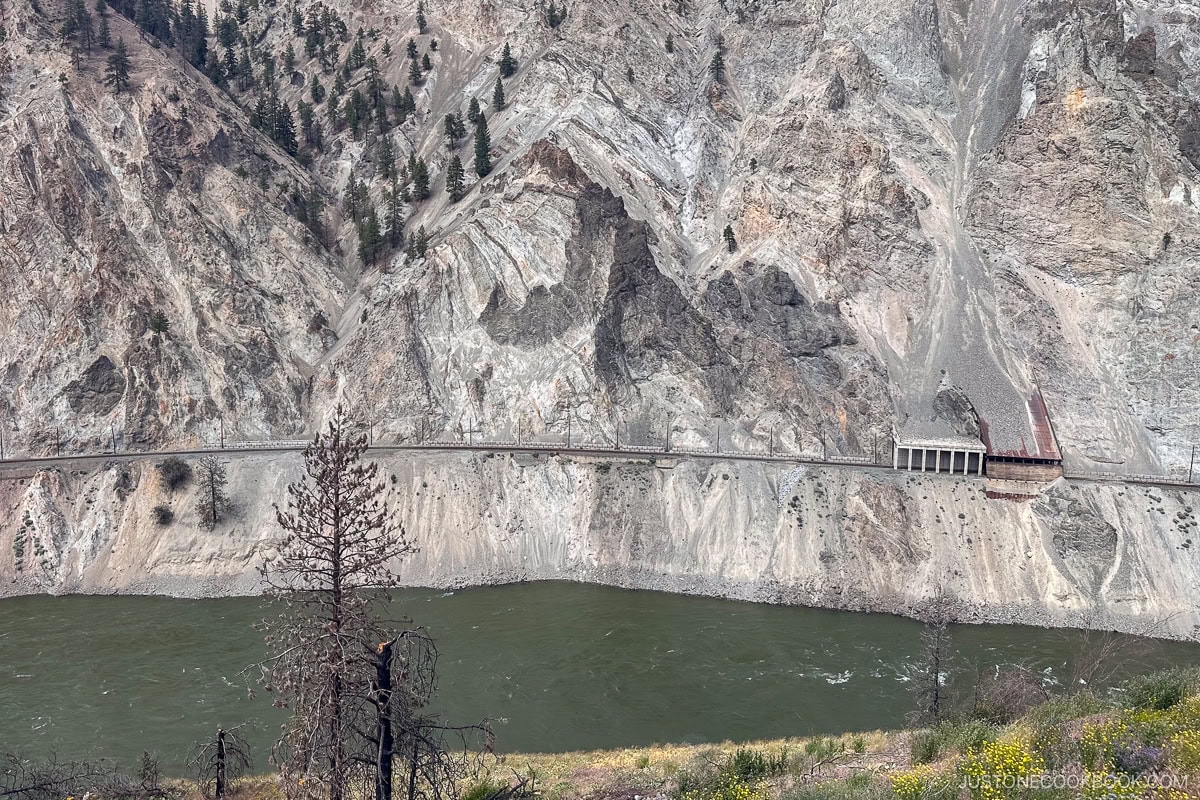 building protecting train track from rock slides