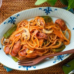 An oval plate containing Napolitan (Japanese Ketchup Spaghetti).