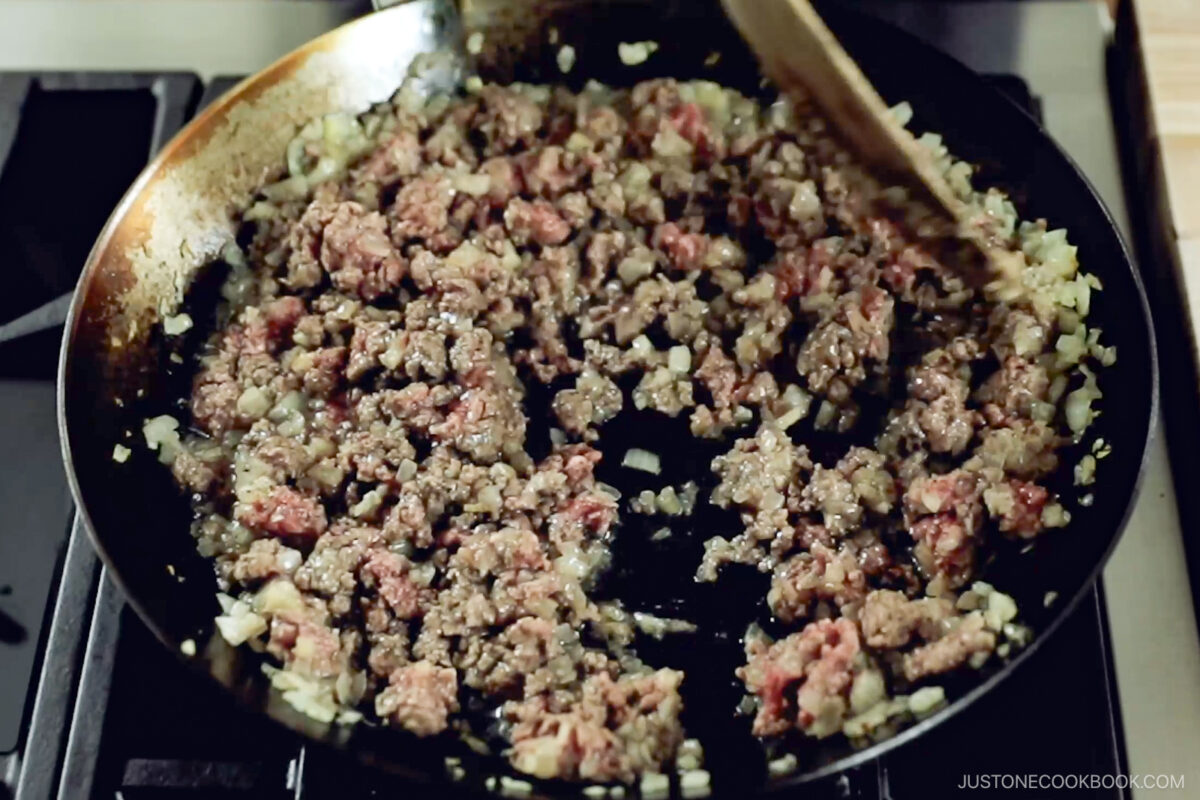 Add the beef and cook until no longer pink.