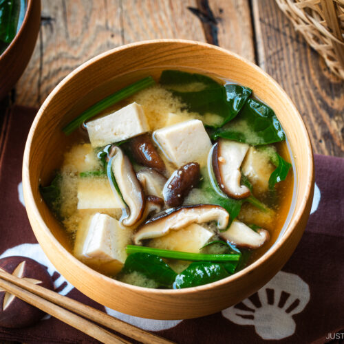 Wooden soup bowls containing Spinach and Mushroom Miso Soup.