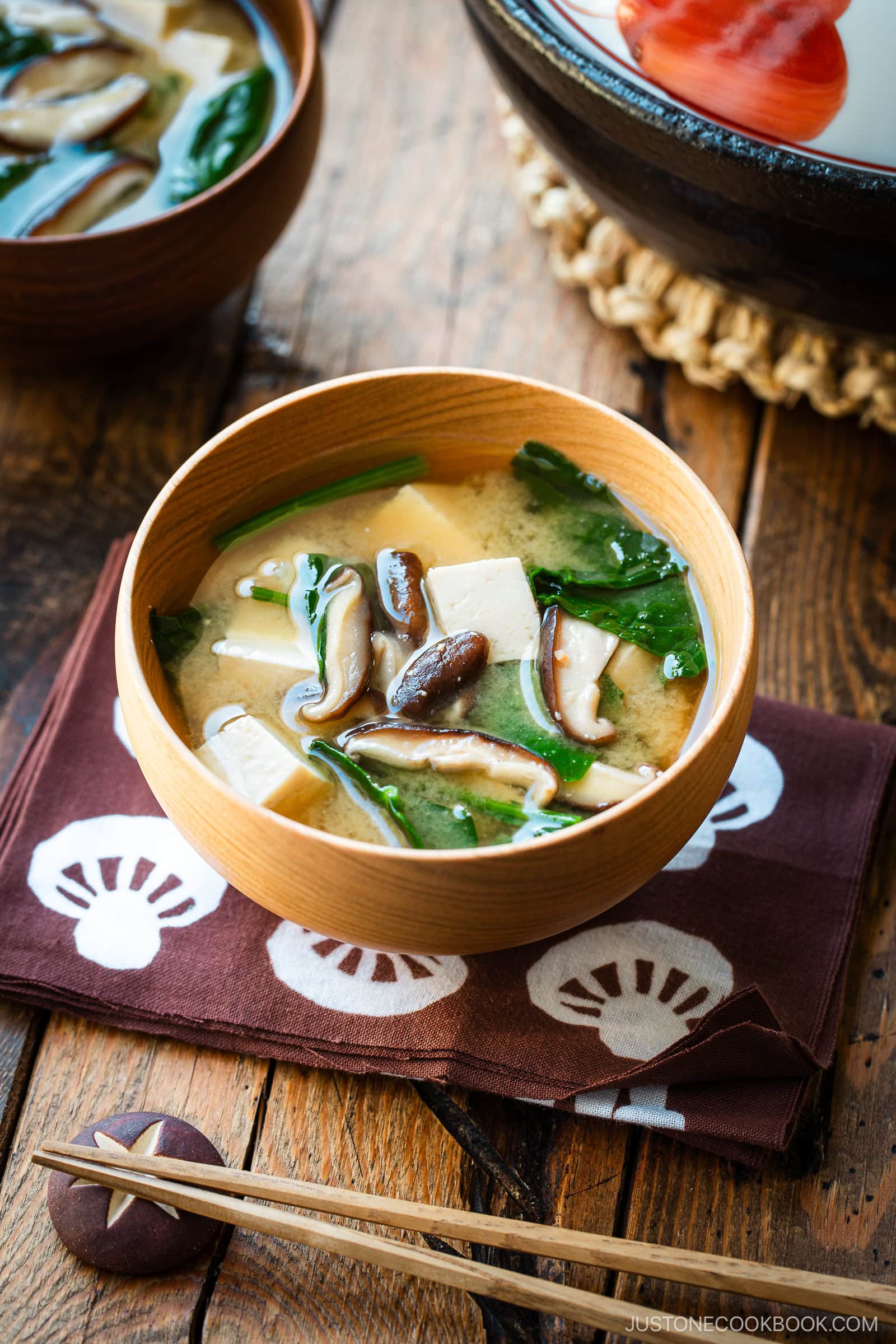 Wooden soup bowls containing Spinach and Mushroom Miso Soup.