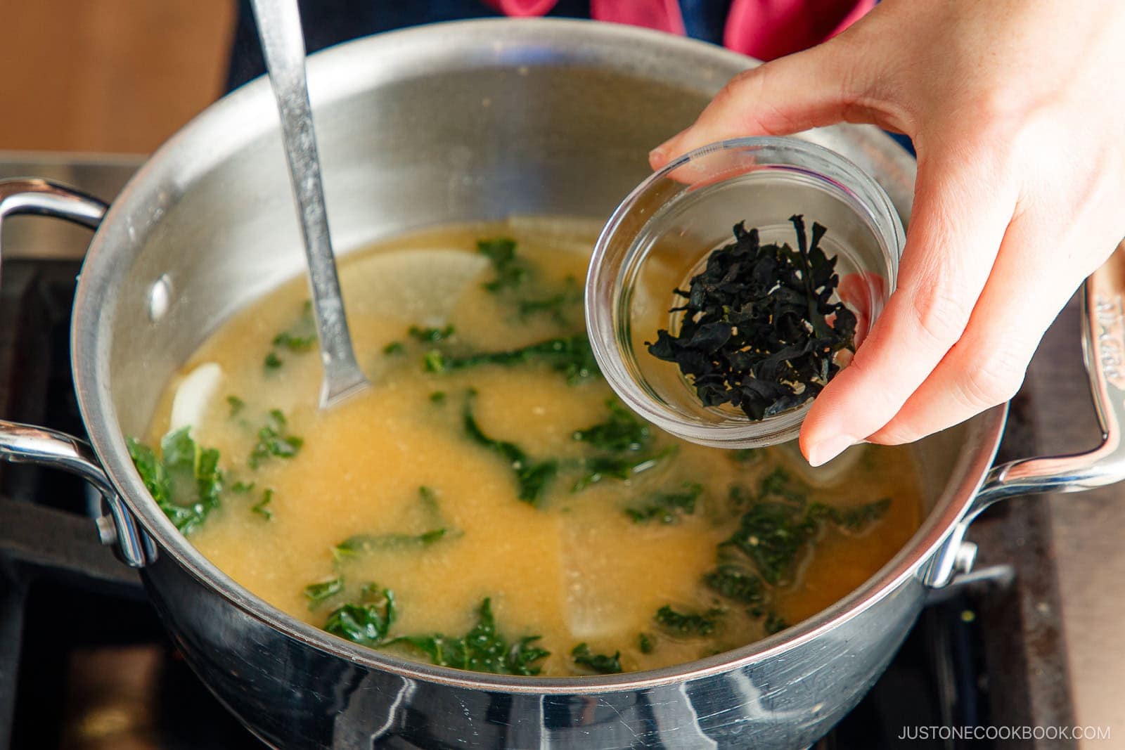 adding wakame seaweed into miso soup