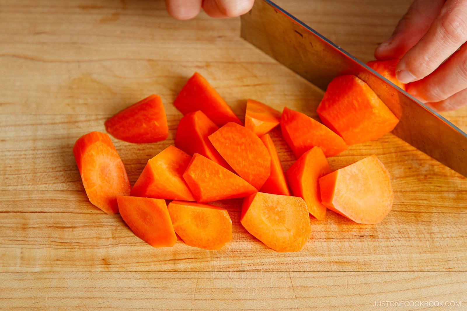 Cutting carrot in rangiri Japanese cutting technique.