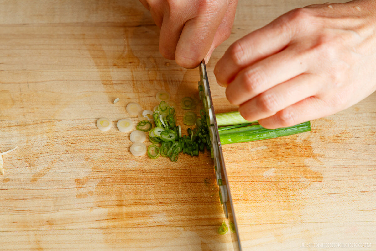 Slice the green onions.