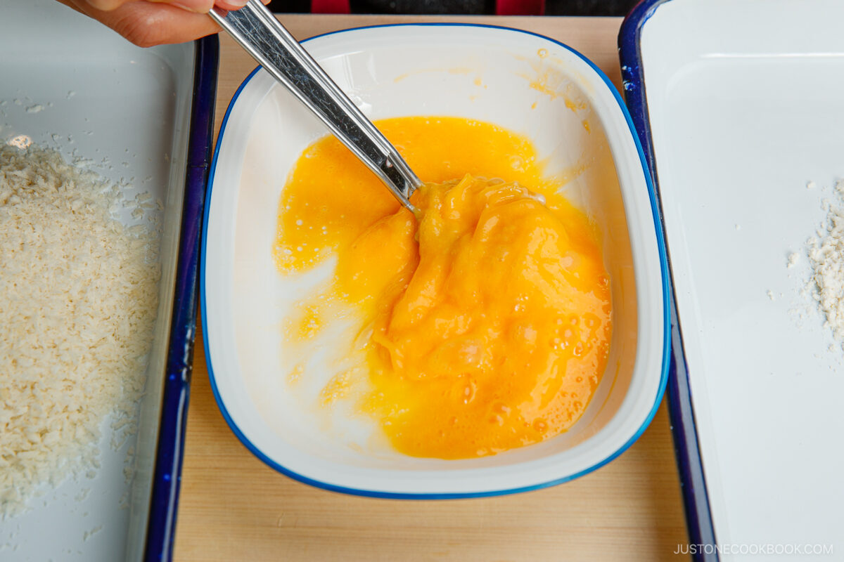Beating eggs.