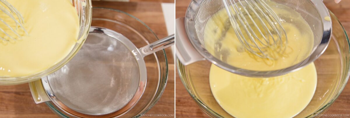 A bowl of yellow batter for Japanese Cheesecake is being poured through a fine mesh strainer into another bowl, with a whisk helping the smooth batter pass through the strainer.
