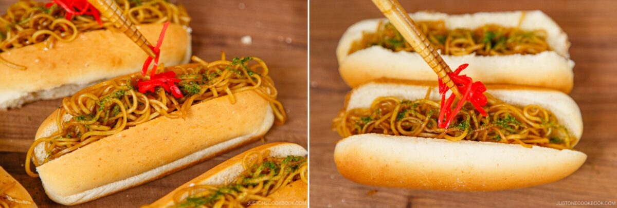 Close-up of yakisoba pan, Japanese stir-fried noodles served in hot dog buns, topped with red pickled ginger and green seaweed powder, on a wooden surface. Chopsticks are lifting some yakisoba pan noodles for a delicious bite.