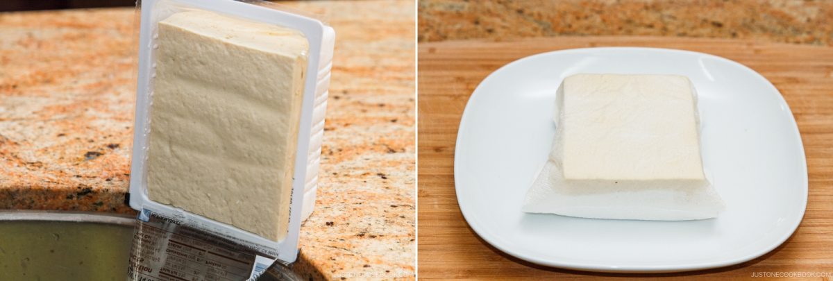 A block of tofu draining in its container over a sink, next to a block of tofu resting on a white plate lined with a paper towel on a countertop—perfect preparation for making a refreshing Bitter Melon and Tofu Salad.