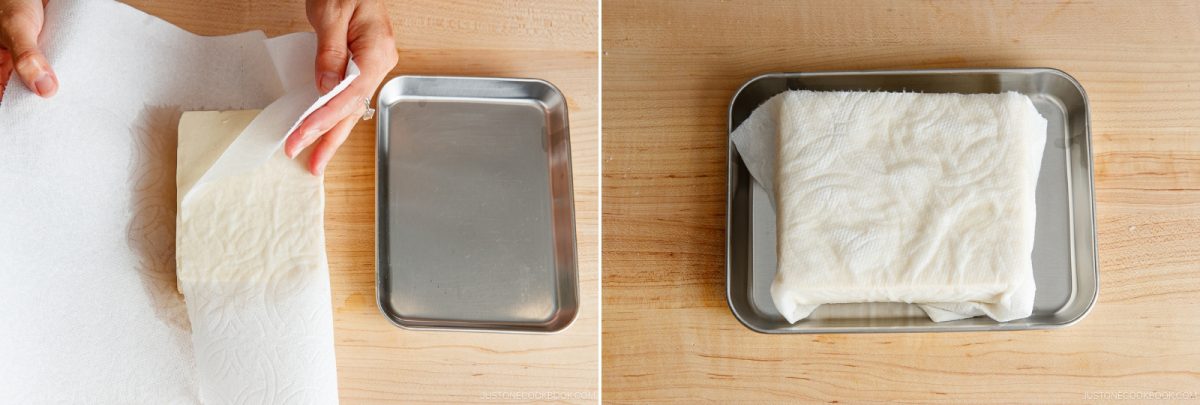 Two images: On the left, a hand wraps tofu in a paper towel beside a tray in preparation for Hiyayakko (Japanese Cold Tofu). On the right, the tofu, now fully wrapped in a paper towel, rests on a metal tray. Both are on a wooden surface.