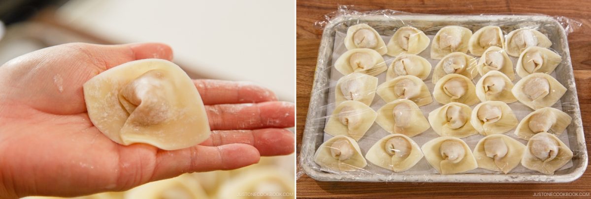 Close-up of a hand holding a single uncooked wonton on the left; on the right, a tray lined with many uncooked wontons covered in plastic wrap, ready to be cooked for Wonton Soup.