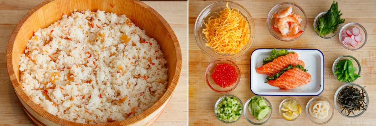 A wooden bowl of Quick & Easy Chirashi Sushi rice with vegetables sits on the left; on the right, various toppings&mdash;salmon, shrimp, shredded cheese, cucumber, lemon, radish, roe, green onion, shiso leaves, and seaweed&mdash;are arranged in small bowls and plates.