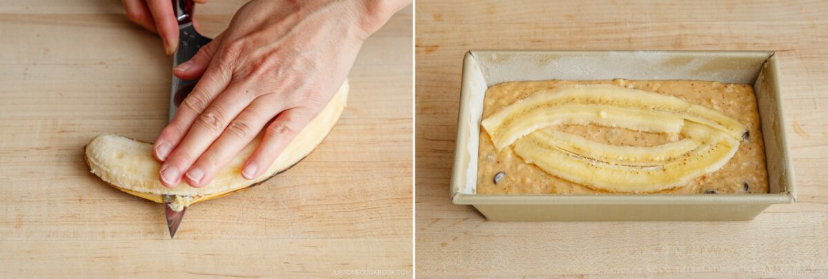 A hand slices a banana in half lengthwise on a wooden cutting board. Next, the sliced banana tops Brown Butter Banana Bread batter in a loaf pan, ready for baking.