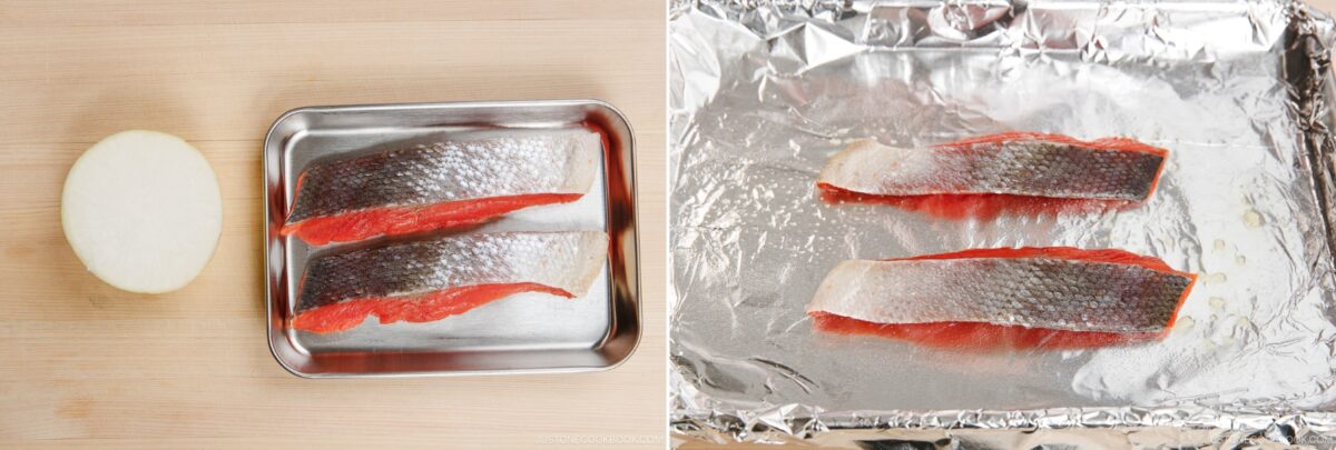 Salted salmon fillets on a tray and baking sheet with foil, ready for grilling or baking.