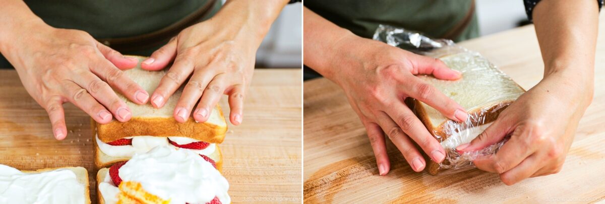 Two images side by side: hands pressing together slices of bread with whipped cream and strawberries, then wrapping the Japanese Fruit Sandwich tightly in plastic wrap on a wooden surface.